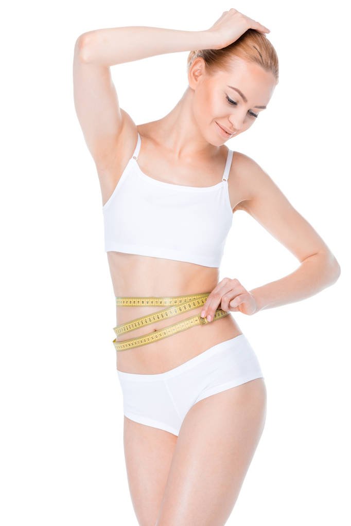 stock photo woman with measuring tape